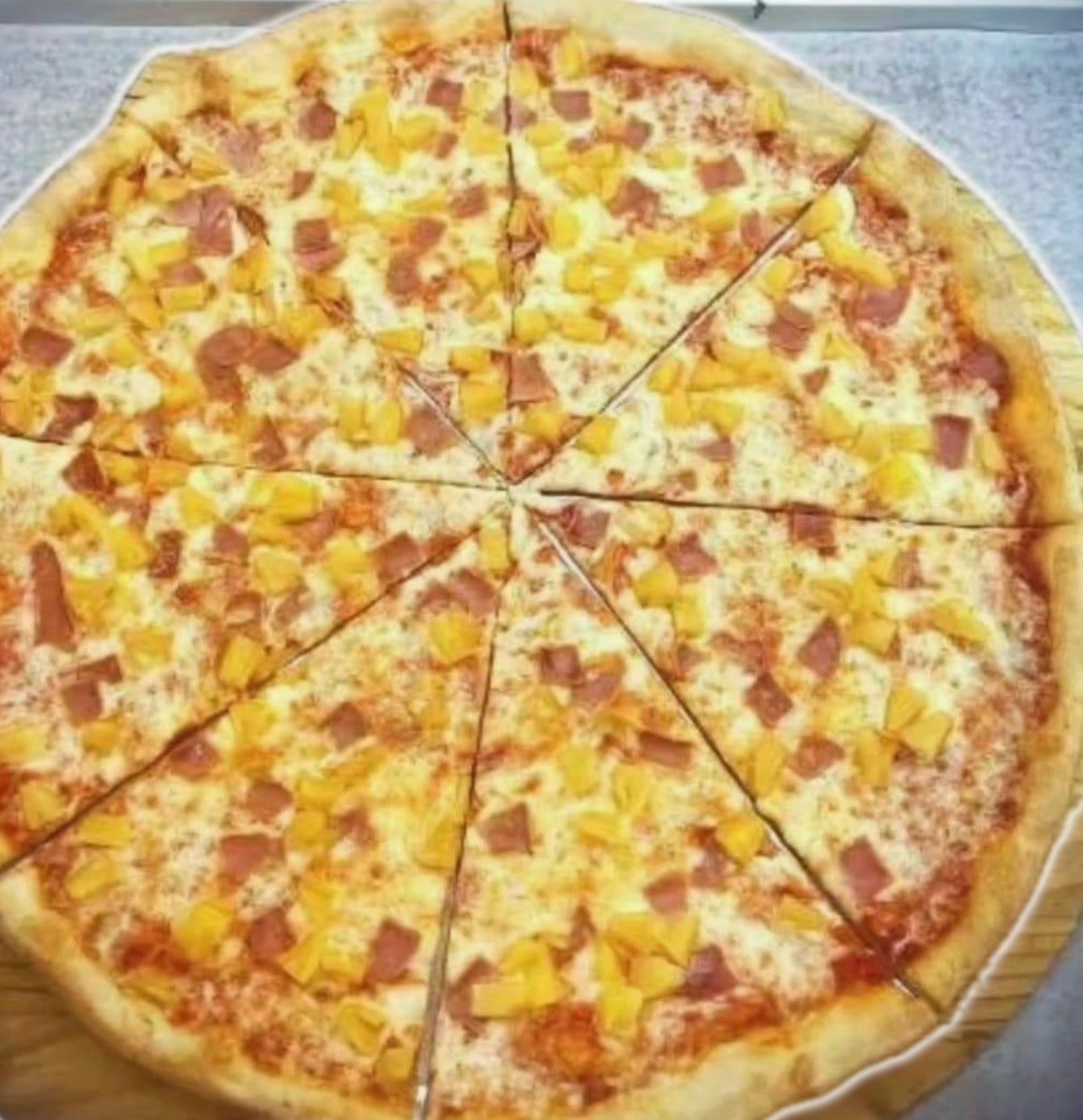 Hawaiian pizza with ham and pineapple